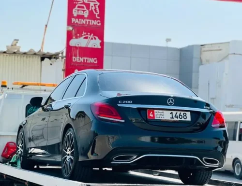 Black Mercedes-Benz E200 on a tow truck